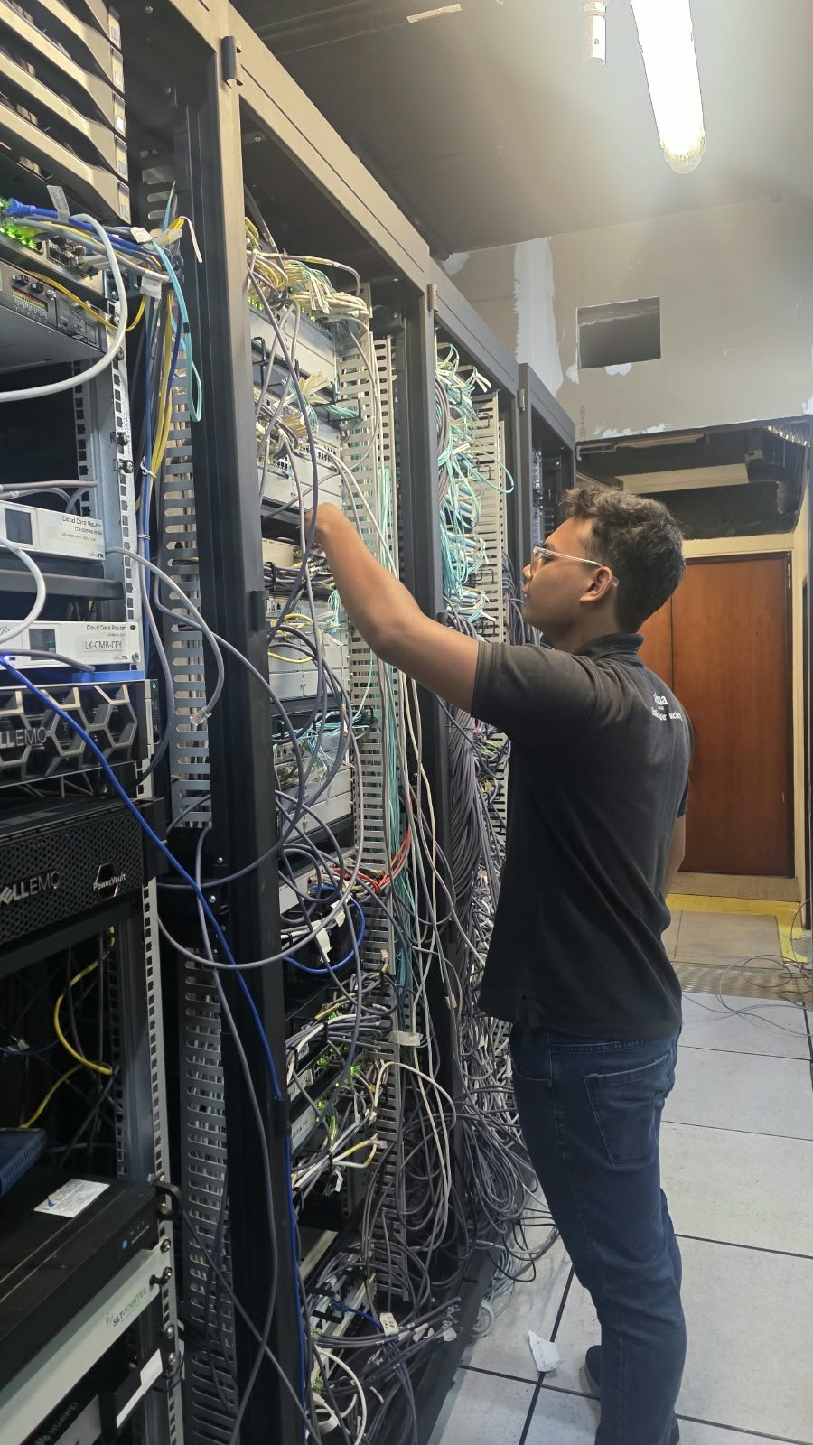 Solution House technician working on enterprise networking equipment